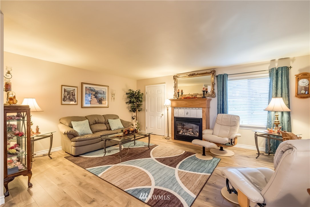 8883 North Pass Road Sumas, WA 98295 - Photo 19 of 25 a living room with furniture and a fireplace