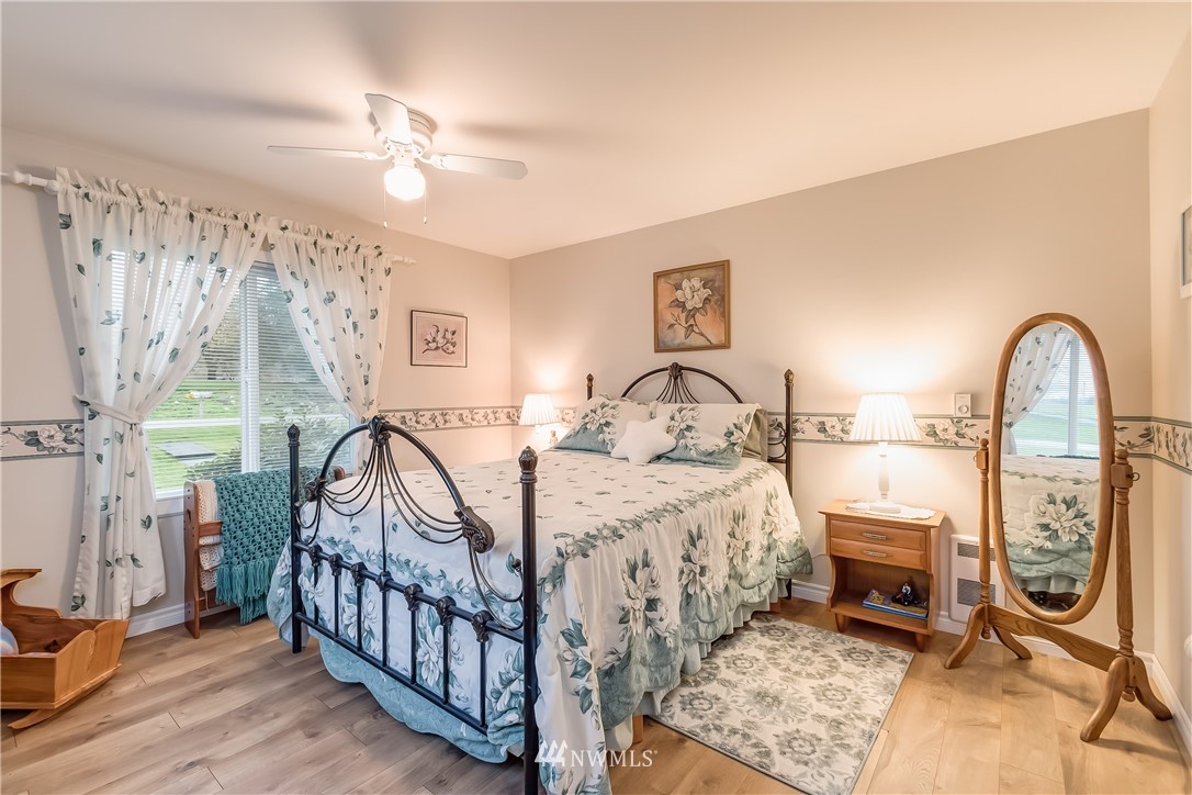 8883 North Pass Road Sumas, WA 98295 - Photo 20 of 25 a bedroom with a bed and a chandelier