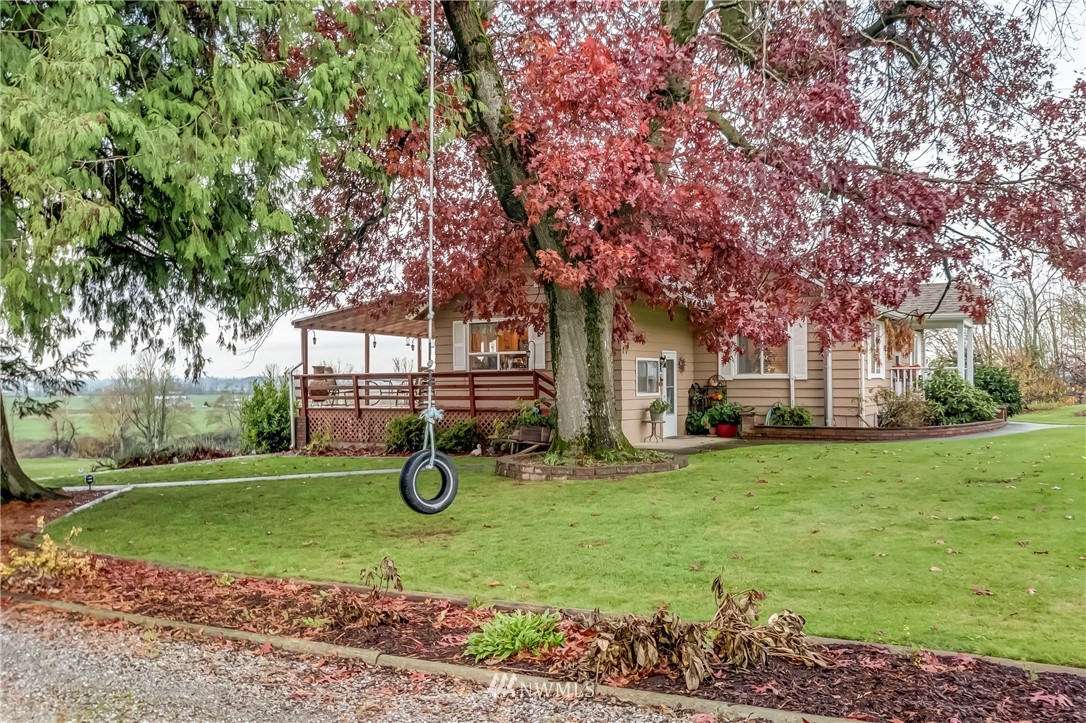 8883 North Pass Road Sumas, WA 98295 - Photo 4 of 25 a house with trees in the background
