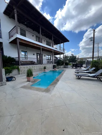 a view of a house with a sink and a yard