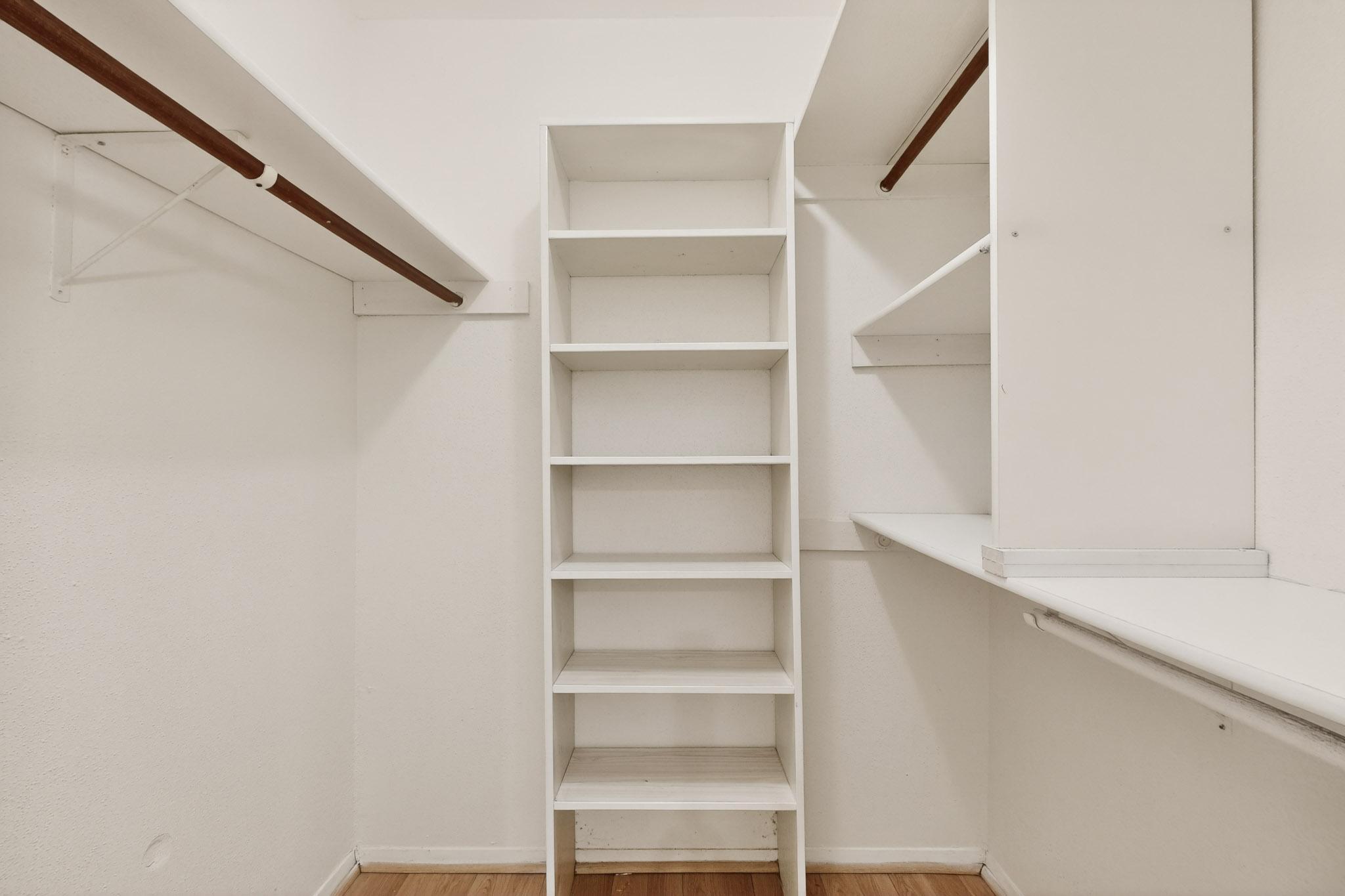 8210 Bent Tree Road, Unit 104 Austin, TX 78759 - Photo 16 of 39 Walk in closet featuring light wood-type flooring