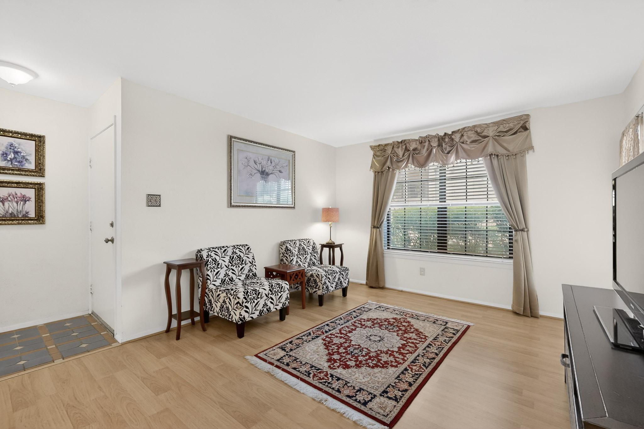 8210 Bent Tree Road, Unit 104 Austin, TX 78759 - Photo 7 of 39 Living area with light wood-style floors
