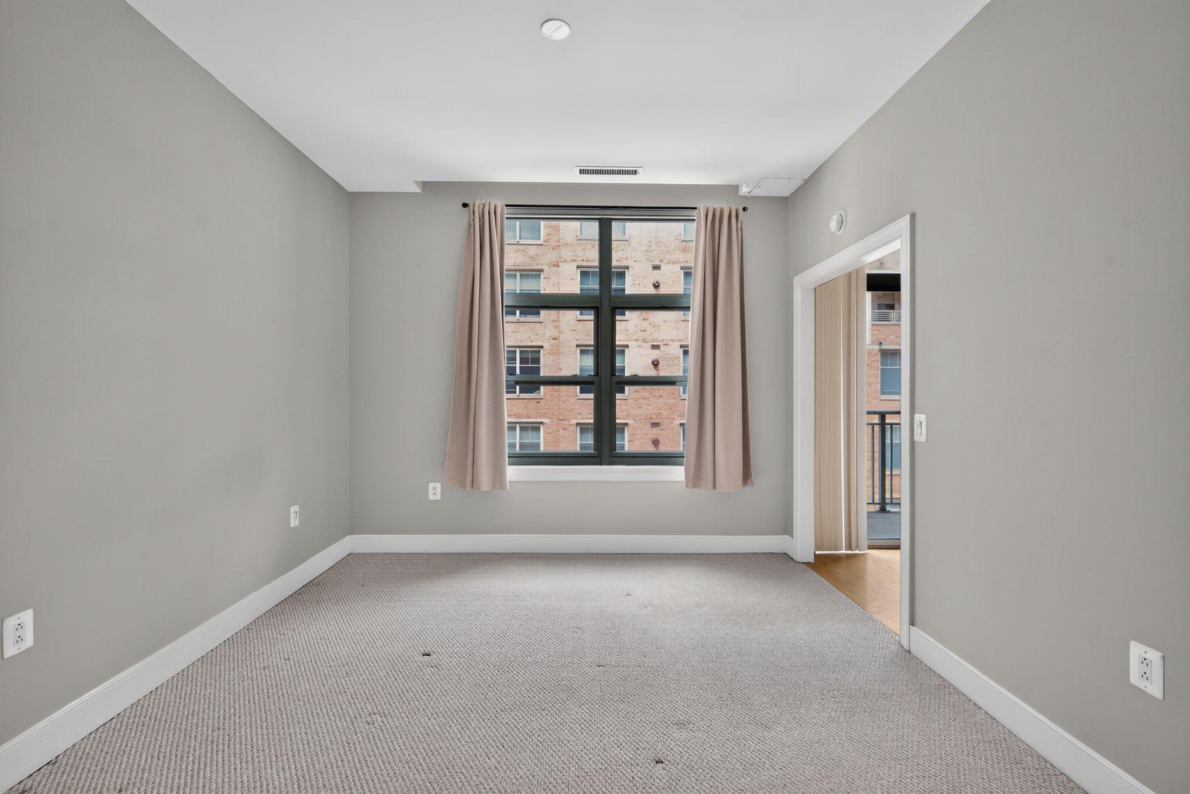 2425 L Street Northwest, Unit 421 Washington, DC 20037 - Photo 10 of 20 Bright, airy bedroom.