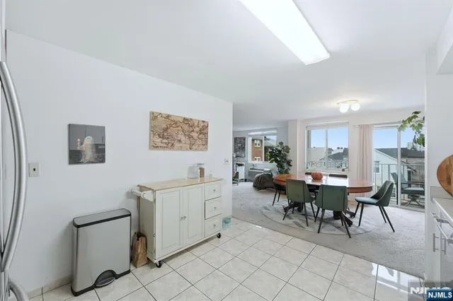 a view of a dining room with furniture and a window