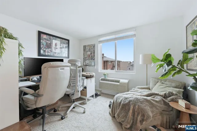 a workspace with furniture and a window