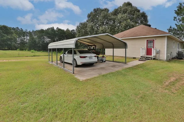 a view of a lake with a yard
