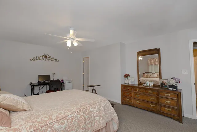 a bed room with a bed and furniture