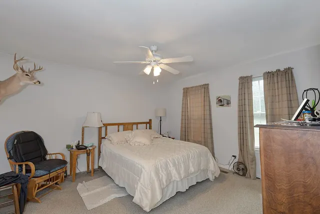 a bathroom with a sink a toilet and vanity