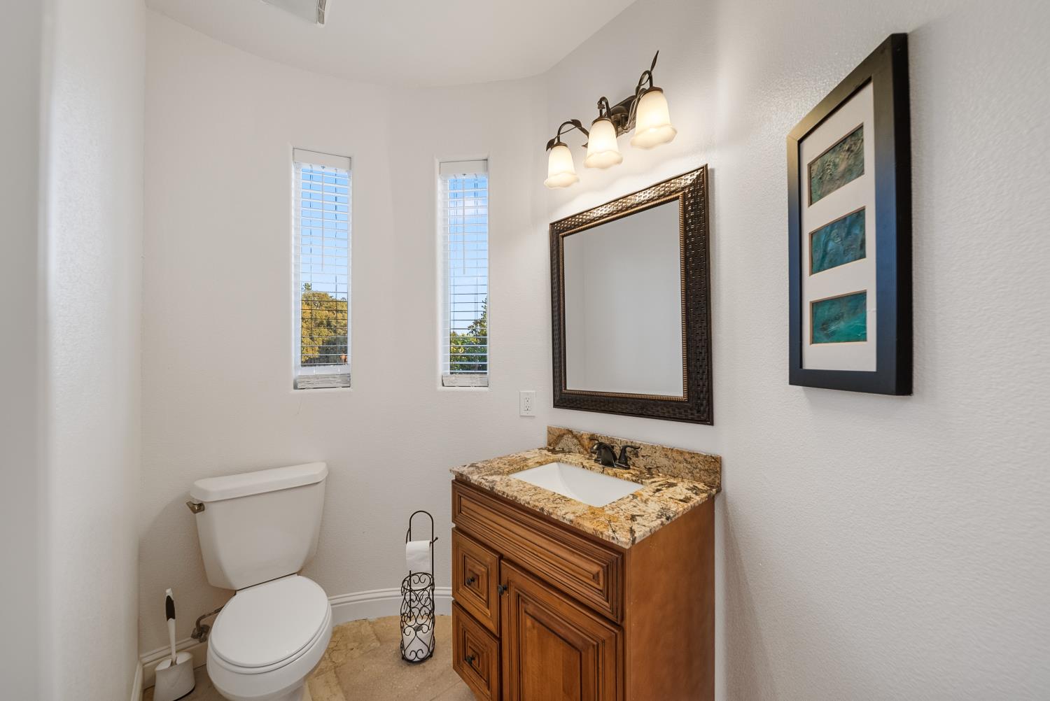 7316 Bermuda Court Rancho Murieta, CA 95683 - Photo 24 of 39 a bathroom with a toilet sink and mirror