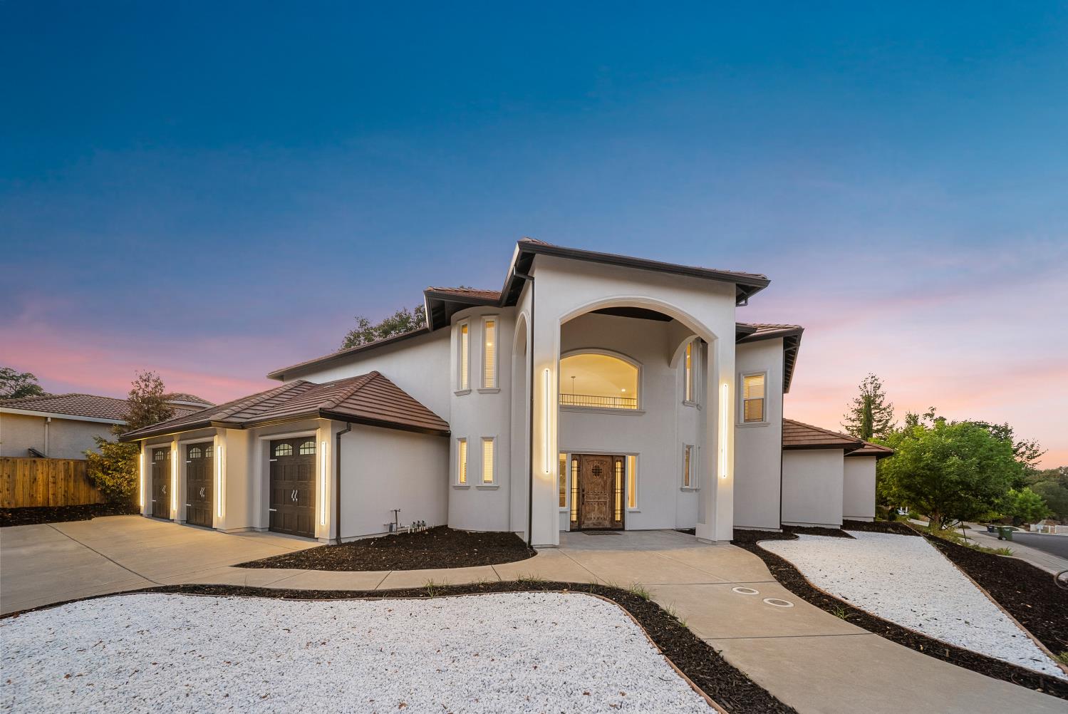 7316 Bermuda Court Rancho Murieta, CA 95683 - Photo 3 of 39 a front view of a house with a yard