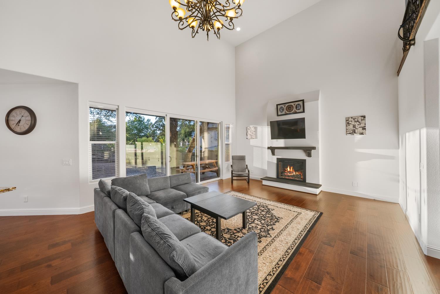 7316 Bermuda Court Rancho Murieta, CA 95683 - Photo 7 of 39 a living room with fireplace furniture and a flat screen tv