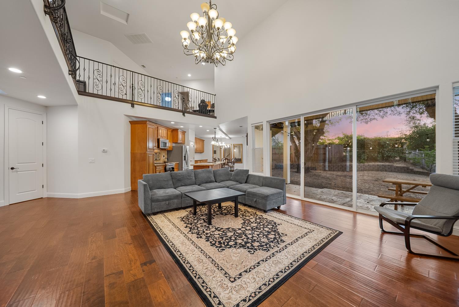 7316 Bermuda Court Rancho Murieta, CA 95683 - Photo 8 of 39 a living room with furniture a chandelier and a table