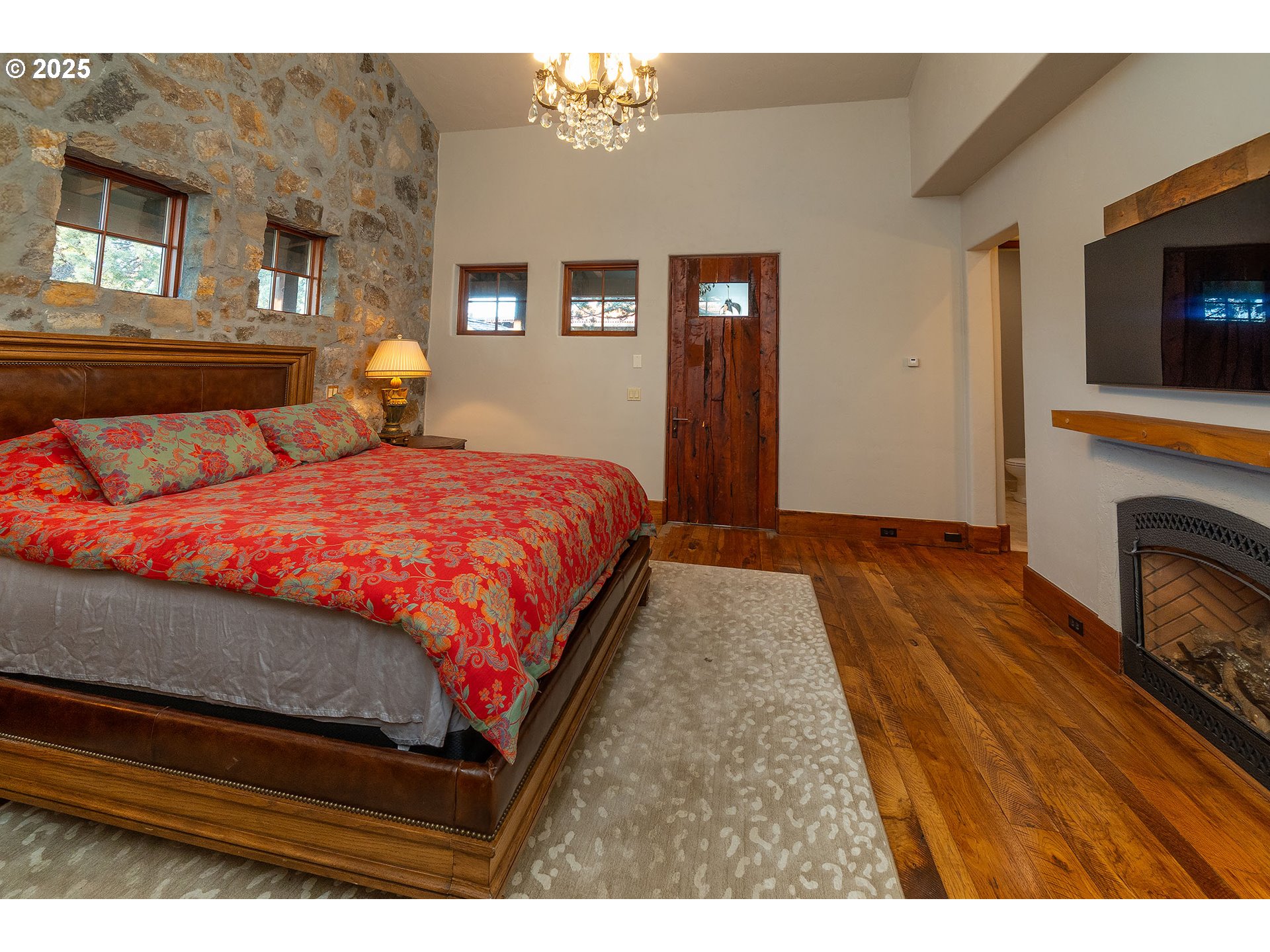 23021 Brushline Court Bend, OR 97701 - Photo 21 of 44 a bedroom with a bed and a television