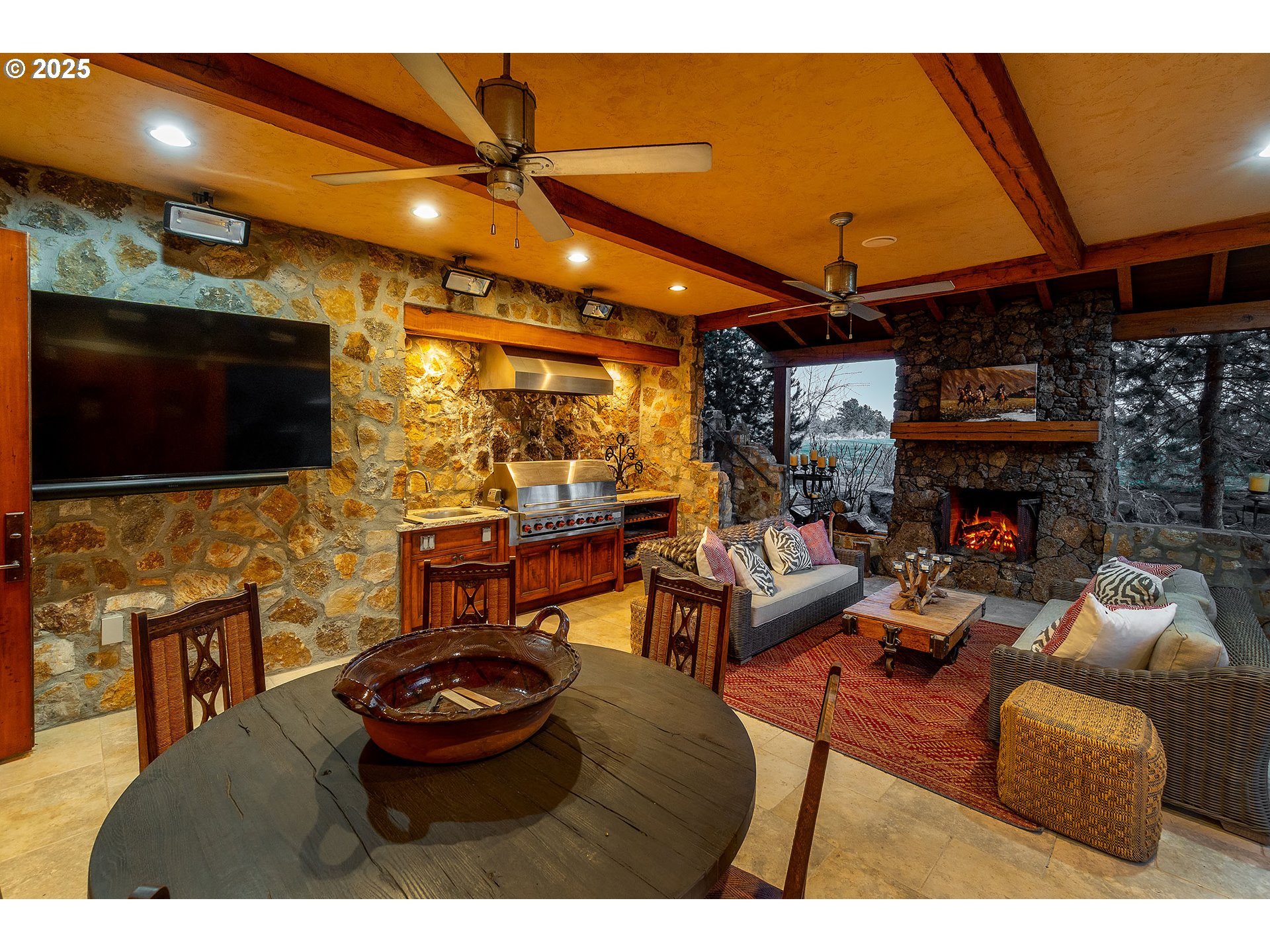 23021 Brushline Court Bend, OR 97701 - Photo 25 of 44 a living room with fireplace furniture and a flat screen tv