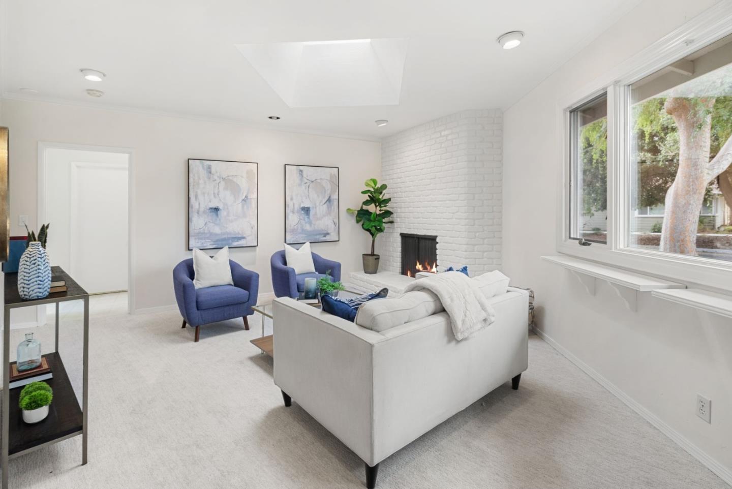 18765 Westview Drive Saratoga, CA 95070 - Photo 19 of 40 a living room with furniture and a potted plant
