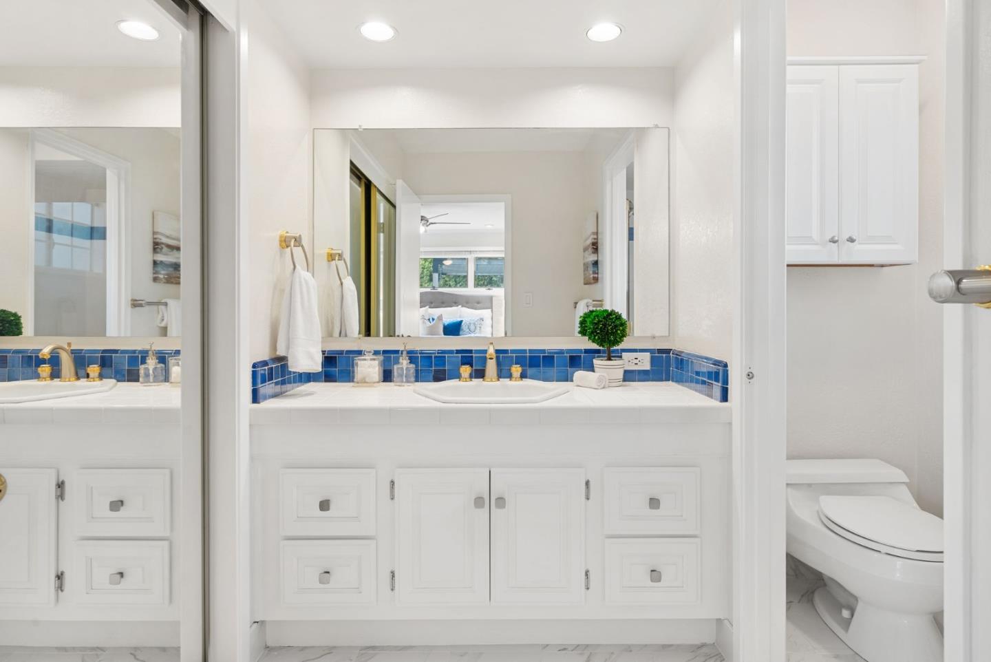 18765 Westview Drive Saratoga, CA 95070 - Photo 21 of 40 a bathroom with a sink a toilet and a mirror