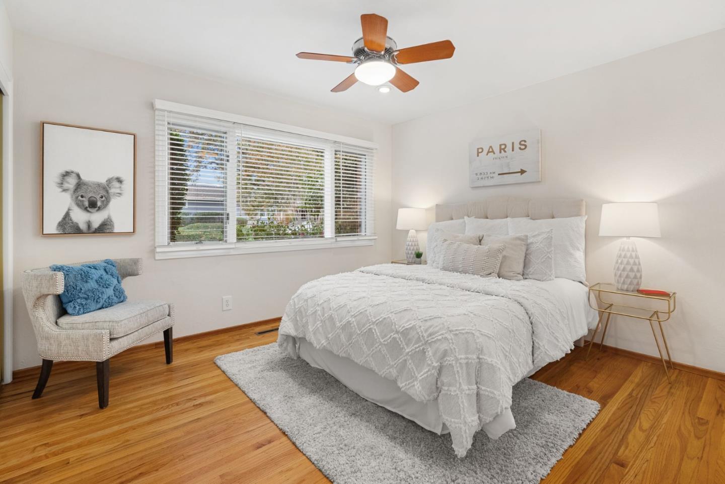 18765 Westview Drive Saratoga, CA 95070 - Photo 23 of 40 a bedroom with a bed and wooden floor