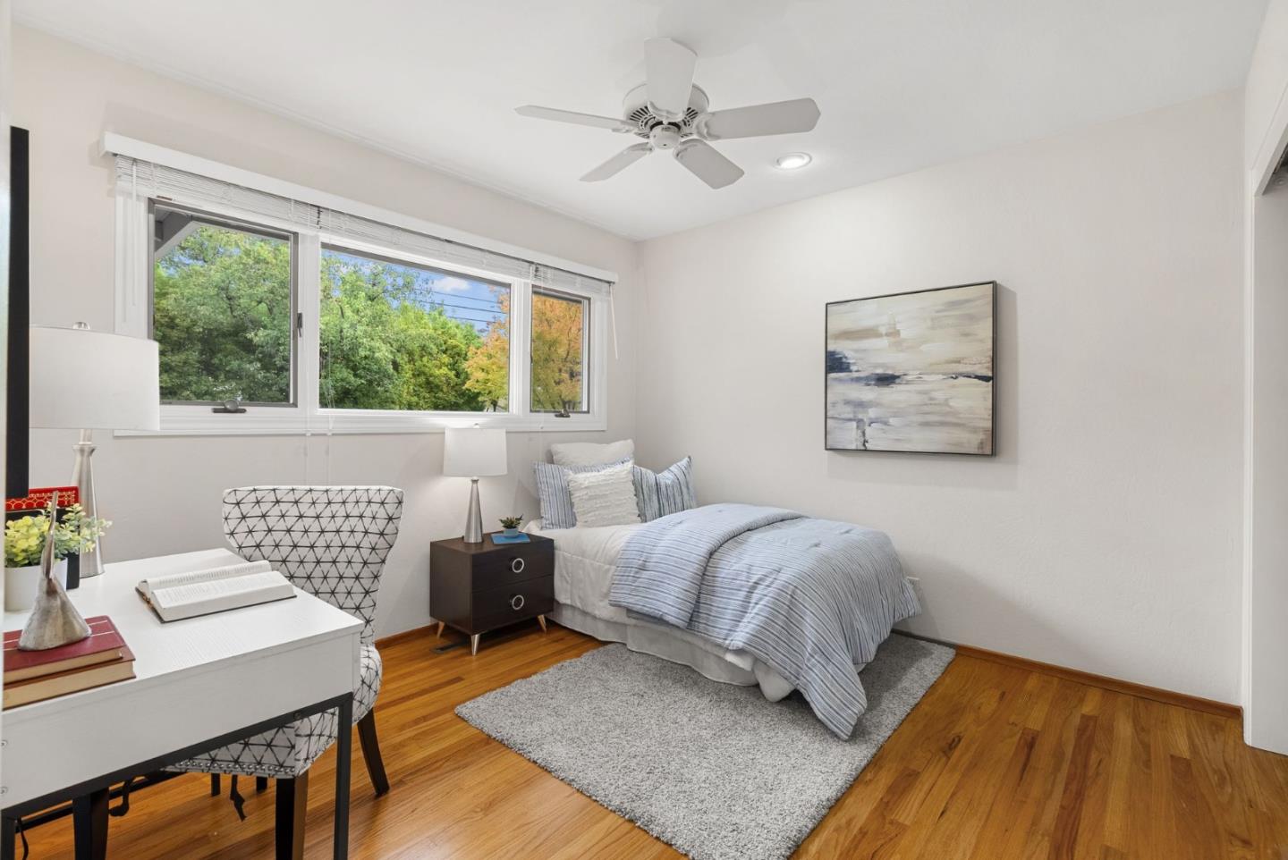 18765 Westview Drive Saratoga, CA 95070 - Photo 24 of 40 a living room with a bed furniture and a window