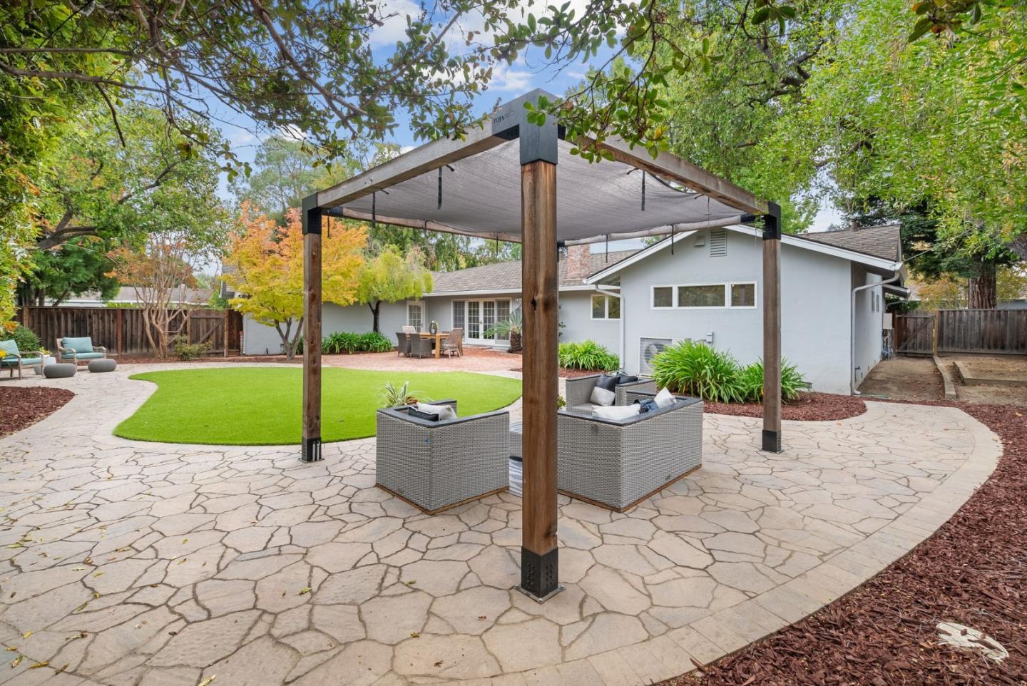 18765 Westview Drive Saratoga, CA 95070 - Photo 31 of 40 a view of a house with backyard and sitting area
