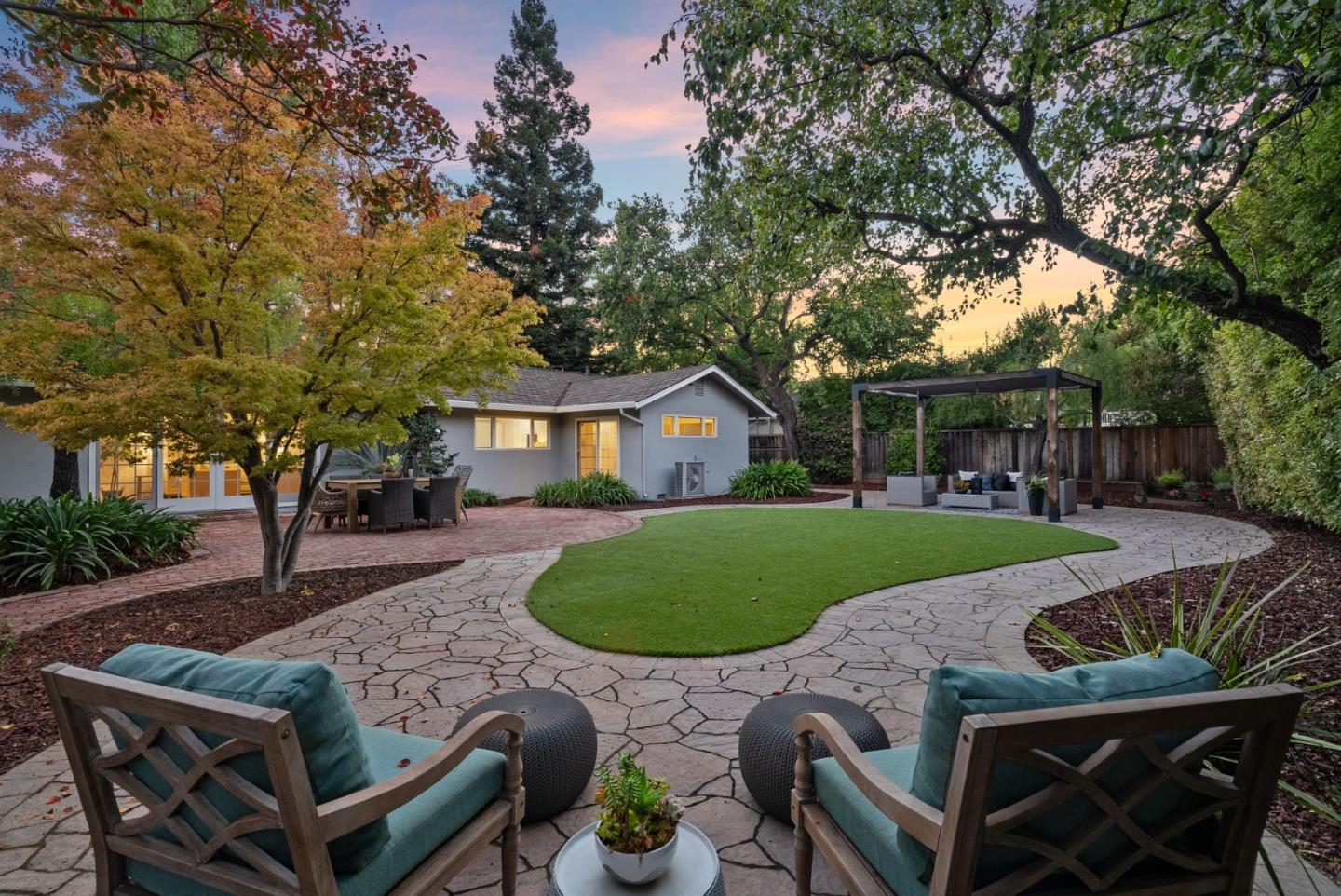 18765 Westview Drive Saratoga, CA 95070 - Photo 36 of 40 a view of a backyard with table and chairs potted plants and large tree