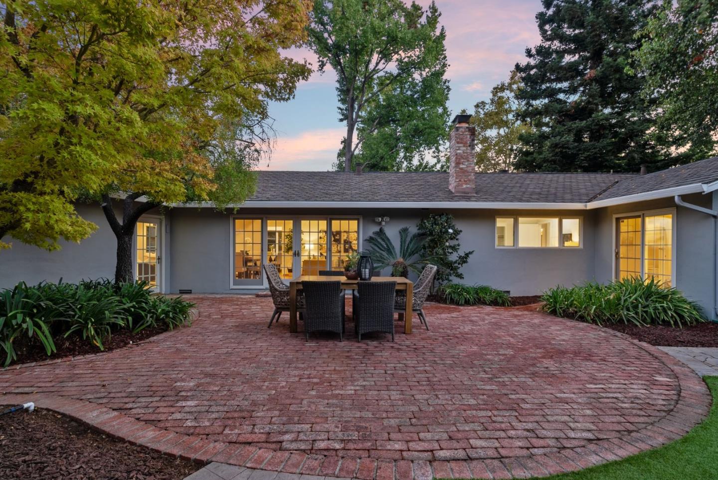 18765 Westview Drive Saratoga, CA 95070 - Photo 37 of 40 a view of patio with table and chairs under an umbrella