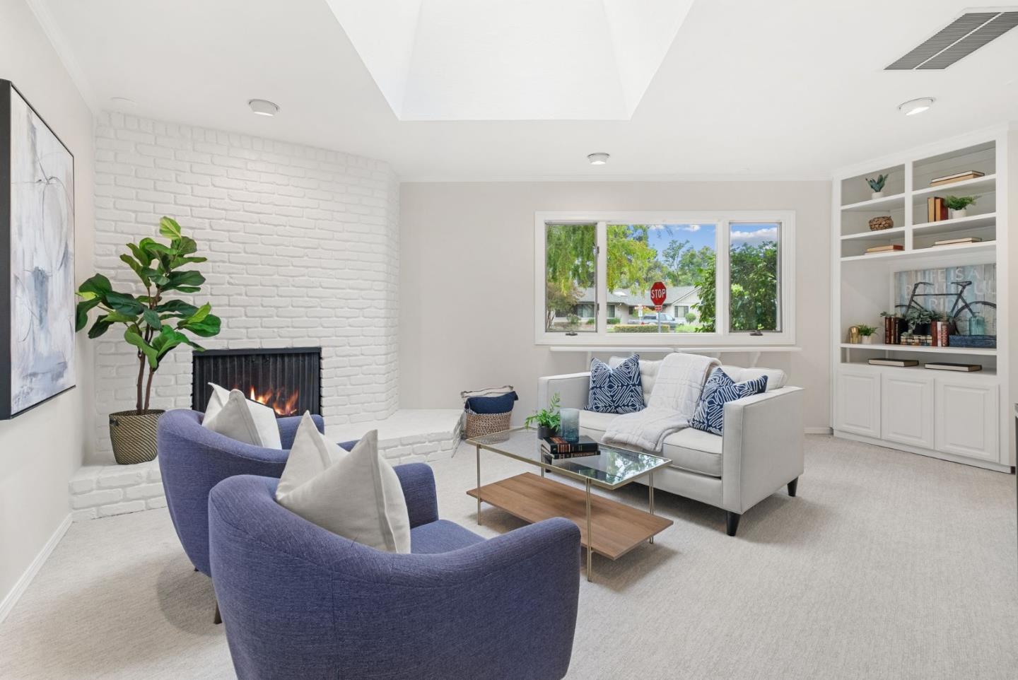 18765 Westview Drive Saratoga, CA 95070 - Photo 5 of 40 a living room with furniture and a potted plant