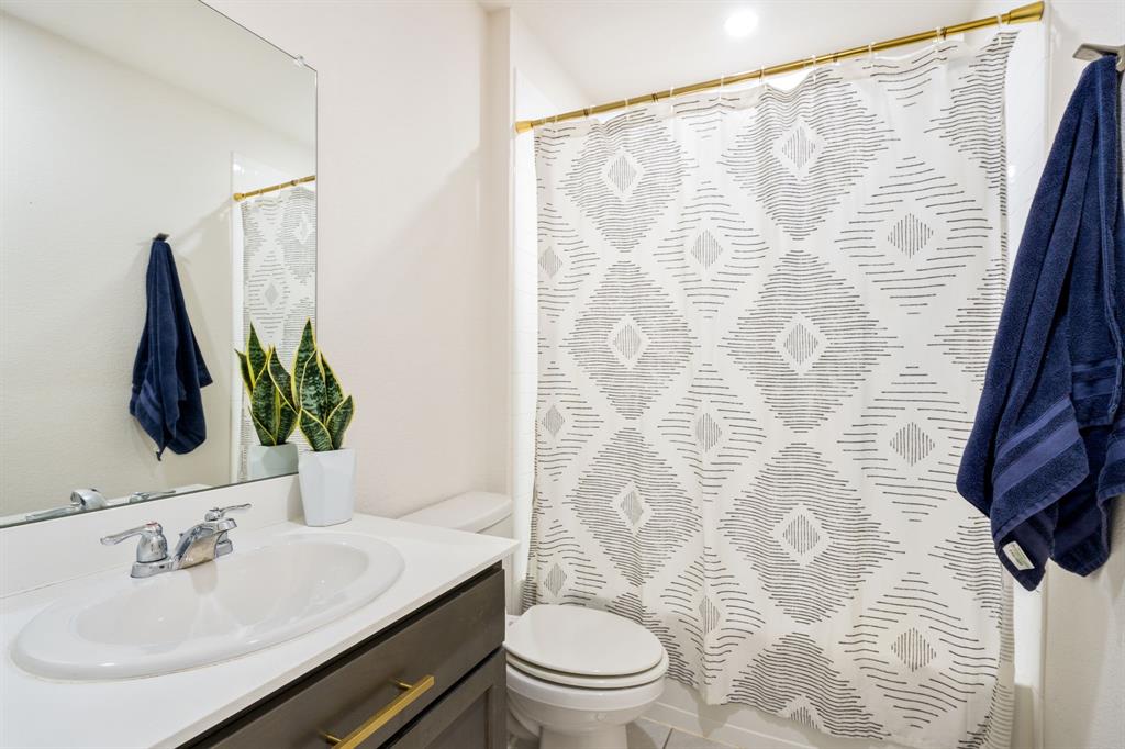 3104 Barzona Road Forney, TX 75126 - Photo 12 of 26 a bathroom with a sink toilet and shower