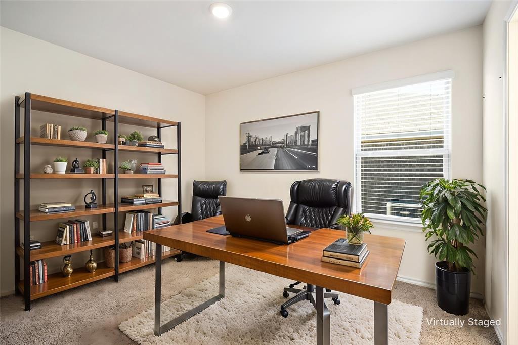3104 Barzona Road Forney, TX 75126 - Photo 13 of 26 a work room with furniture and a bookshelf