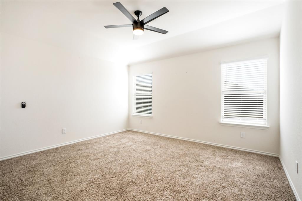 3104 Barzona Road Forney, TX 75126 - Photo 16 of 26 an empty room with a window and a fan