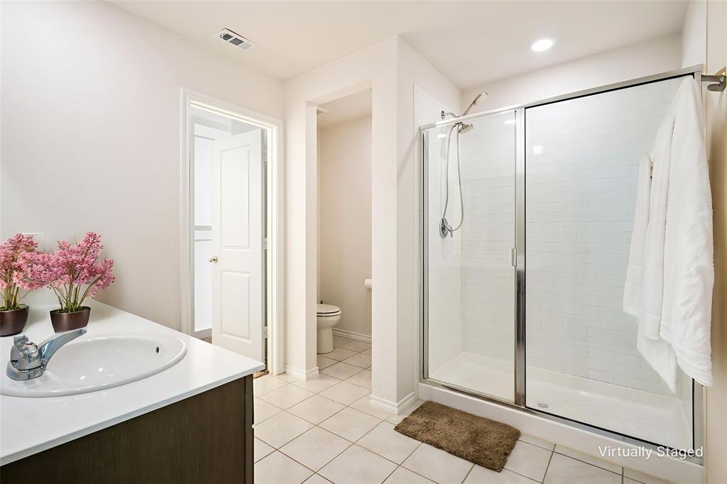 3104 Barzona Road Forney, TX 75126 - Photo 18 of 26 a bathroom with a sink shower and a mirror