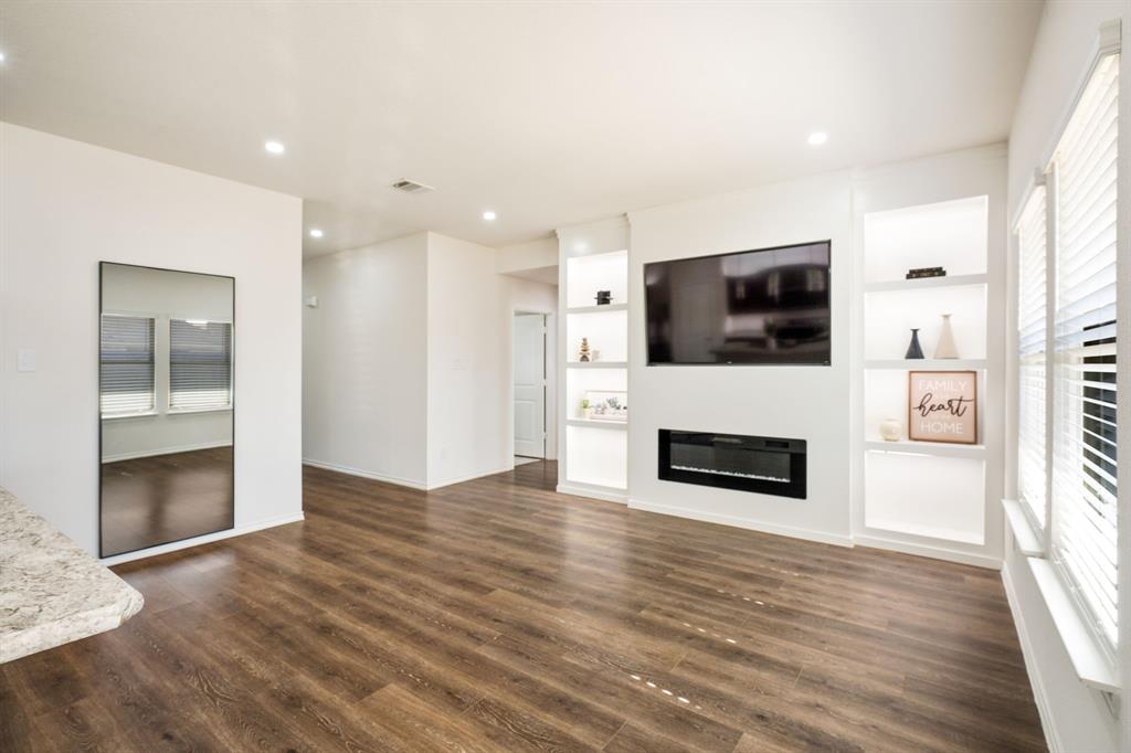 3104 Barzona Road Forney, TX 75126 - Photo 2 of 26 a view of kitchen with microwave a stove and a refrigerator