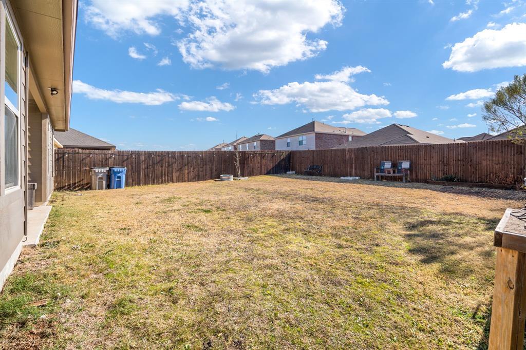 3104 Barzona Road Forney, TX 75126 - Photo 25 of 26 a view of a yard with a house