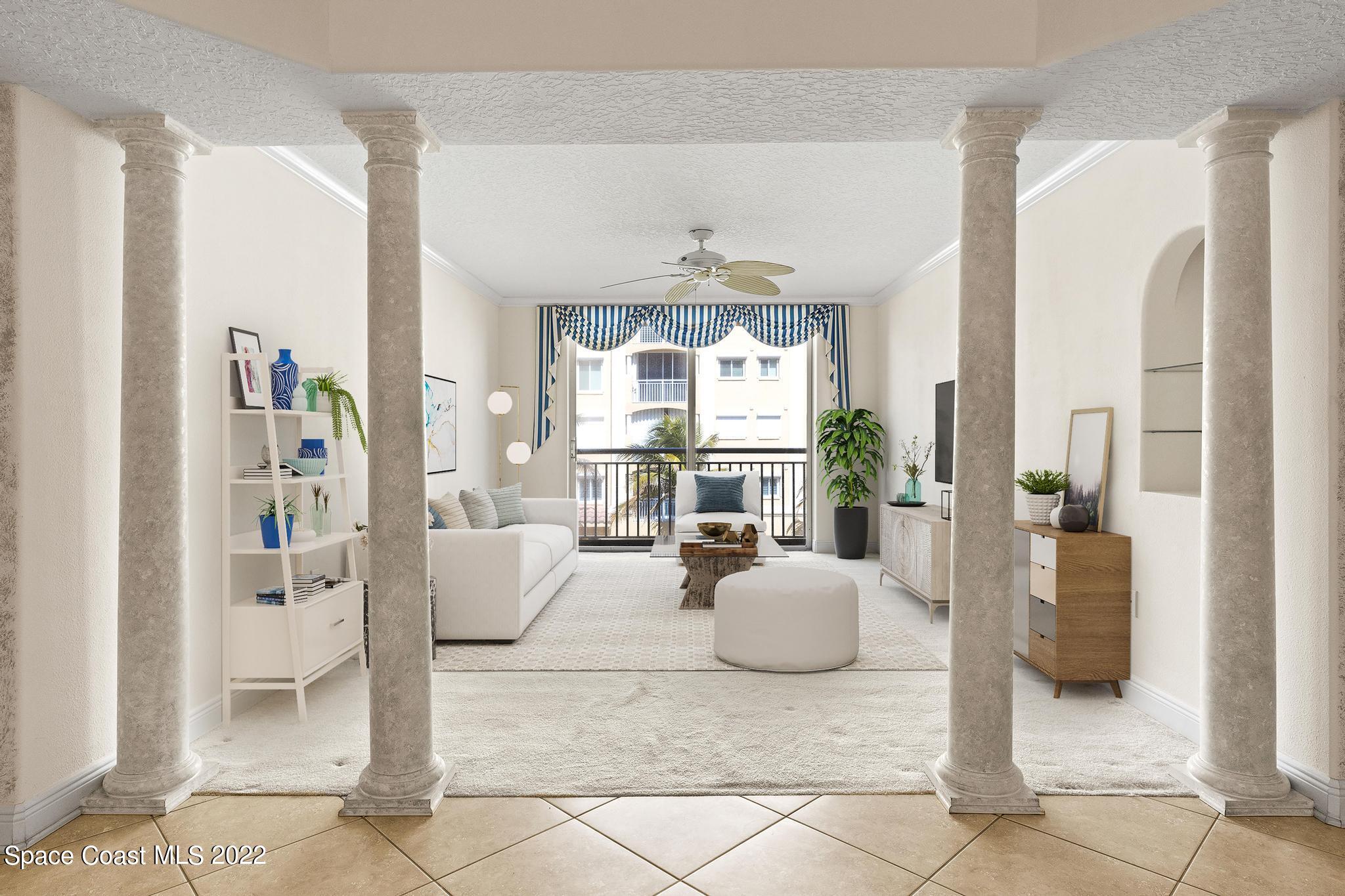 1095 Florida A1A, Unit 2301 Satellite Beach, FL 32937 - Photo 13 of 26 a living room with furniture and a large window