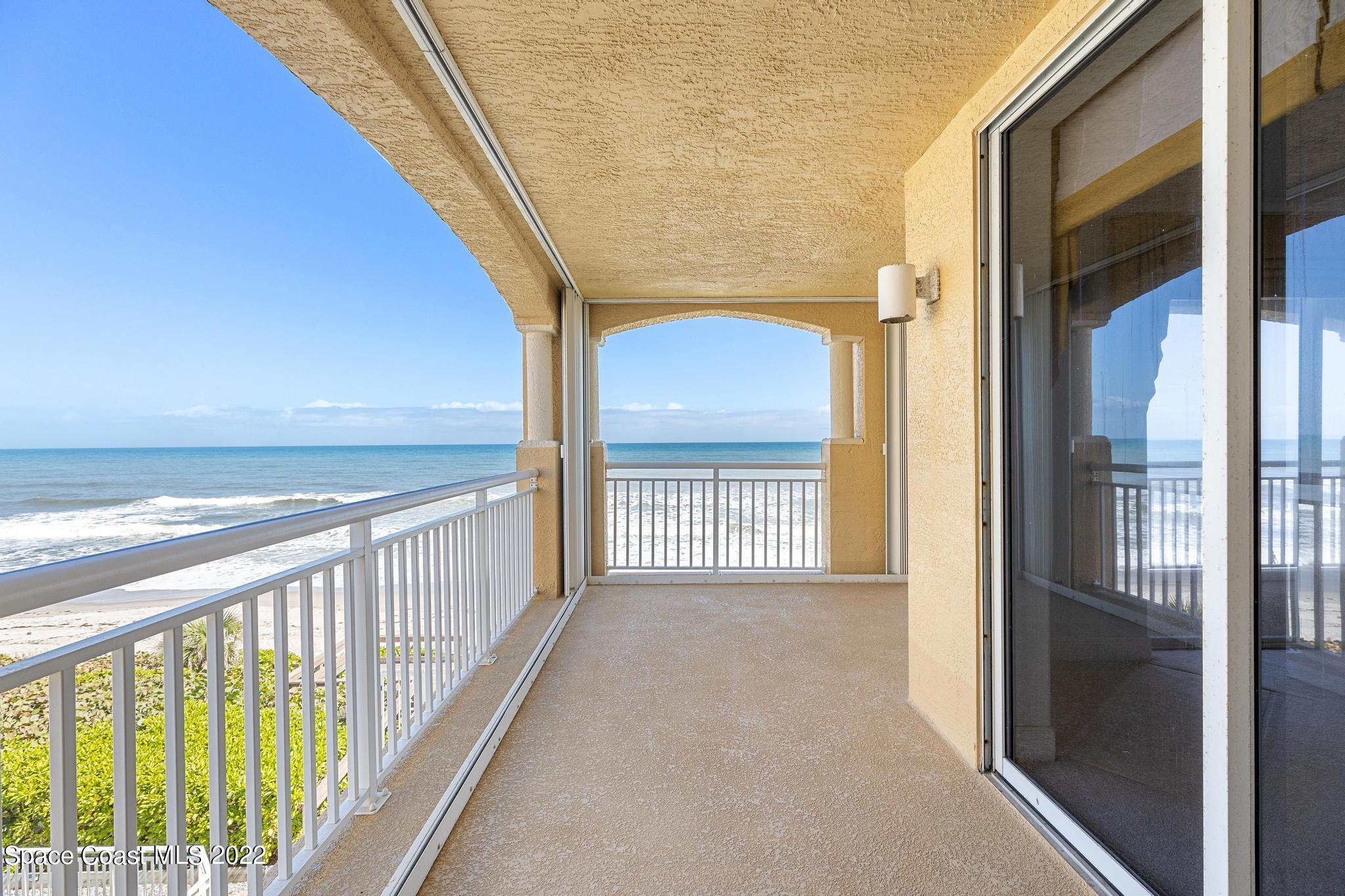 1095 Florida A1A, Unit 2301 Satellite Beach, FL 32937 - Photo 19 of 26 a view of a hallway with wooden floor and stairs