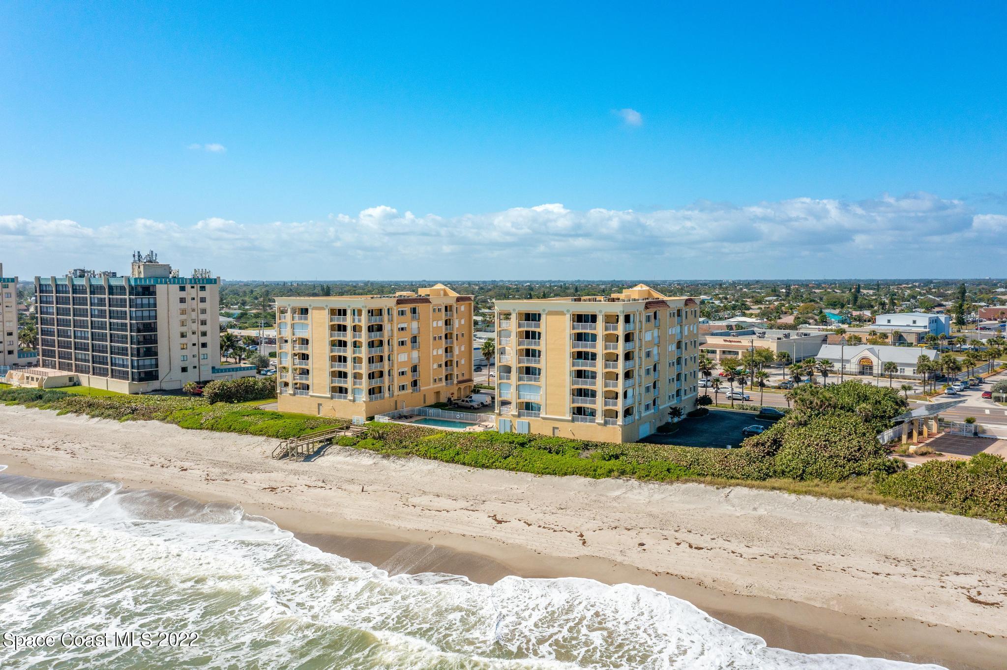 1095 Florida A1A, Unit 2301 Satellite Beach, FL 32937 - Photo 22 of 26 a view of street with a big yard