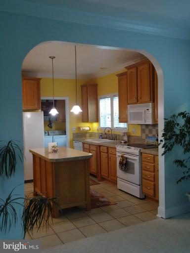 3504 Long Meadow Road Middletown, VA 22645 - Photo 11 of 28 a kitchen with kitchen island granite countertop a sink and cabinets
