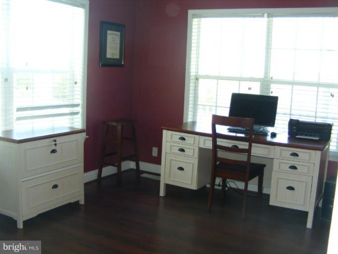 3504 Long Meadow Road Middletown, VA 22645 - Photo 21 of 28 a view of a workspace with furniture and a window