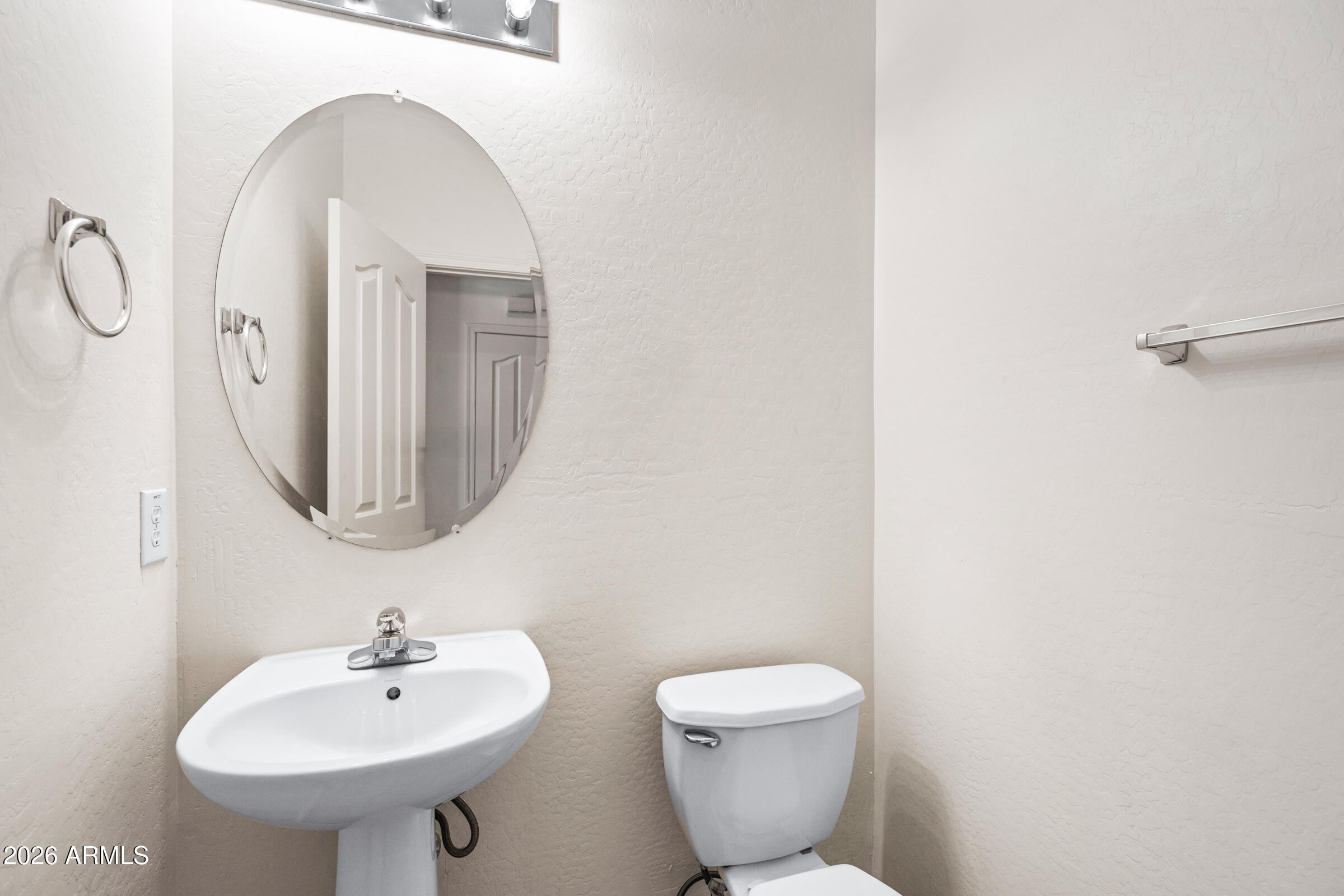 3029 East Franklin Avenue Gilbert, AZ 85295 - Photo 14 of 38 a bathroom with a toilet sink and mirror