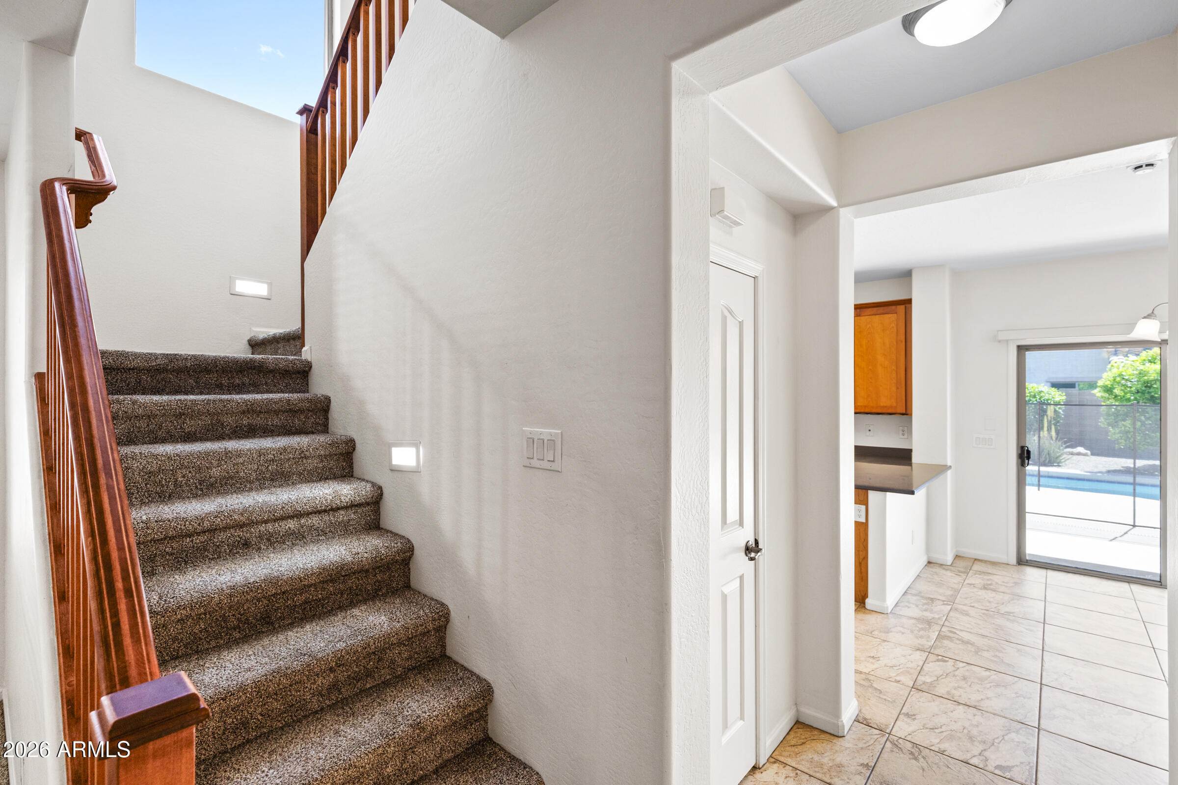 3029 East Franklin Avenue Gilbert, AZ 85295 - Photo 15 of 38 a view of a hallway with wooden floor and entryway