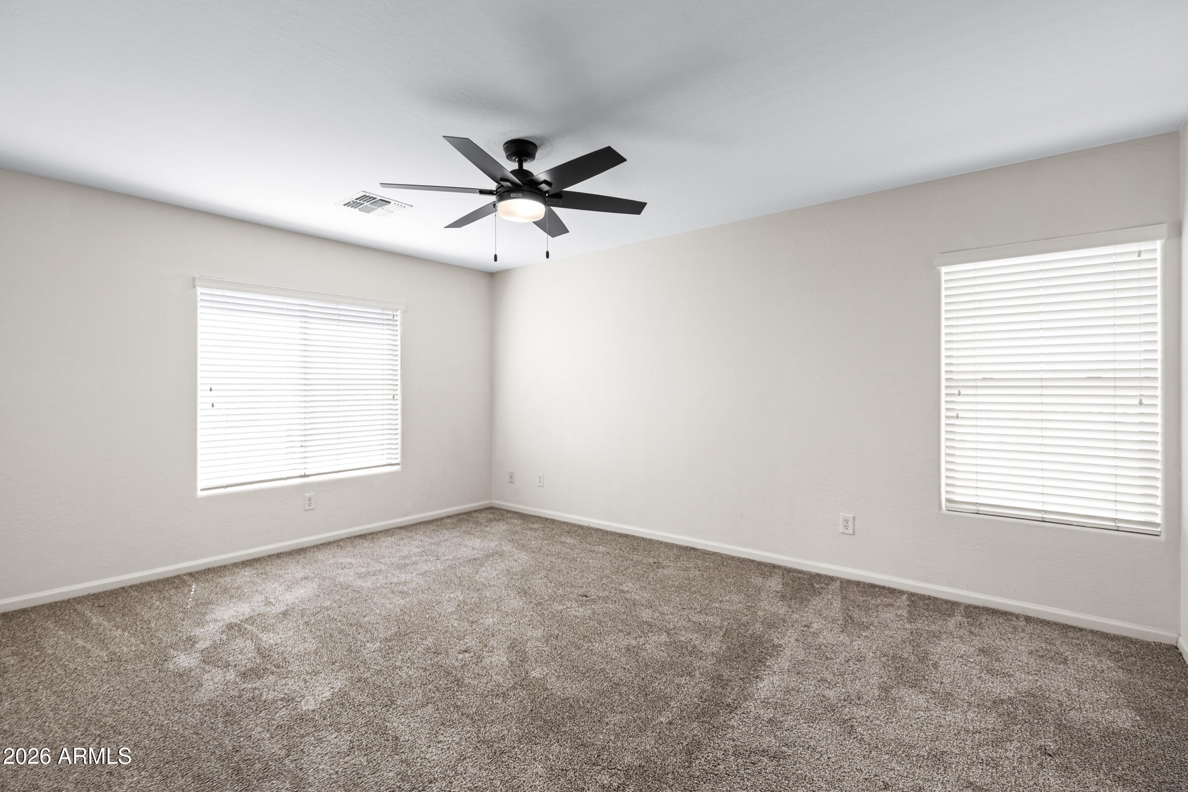3029 East Franklin Avenue Gilbert, AZ 85295 - Photo 18 of 38 a view of a big room with windows and chandelier fan