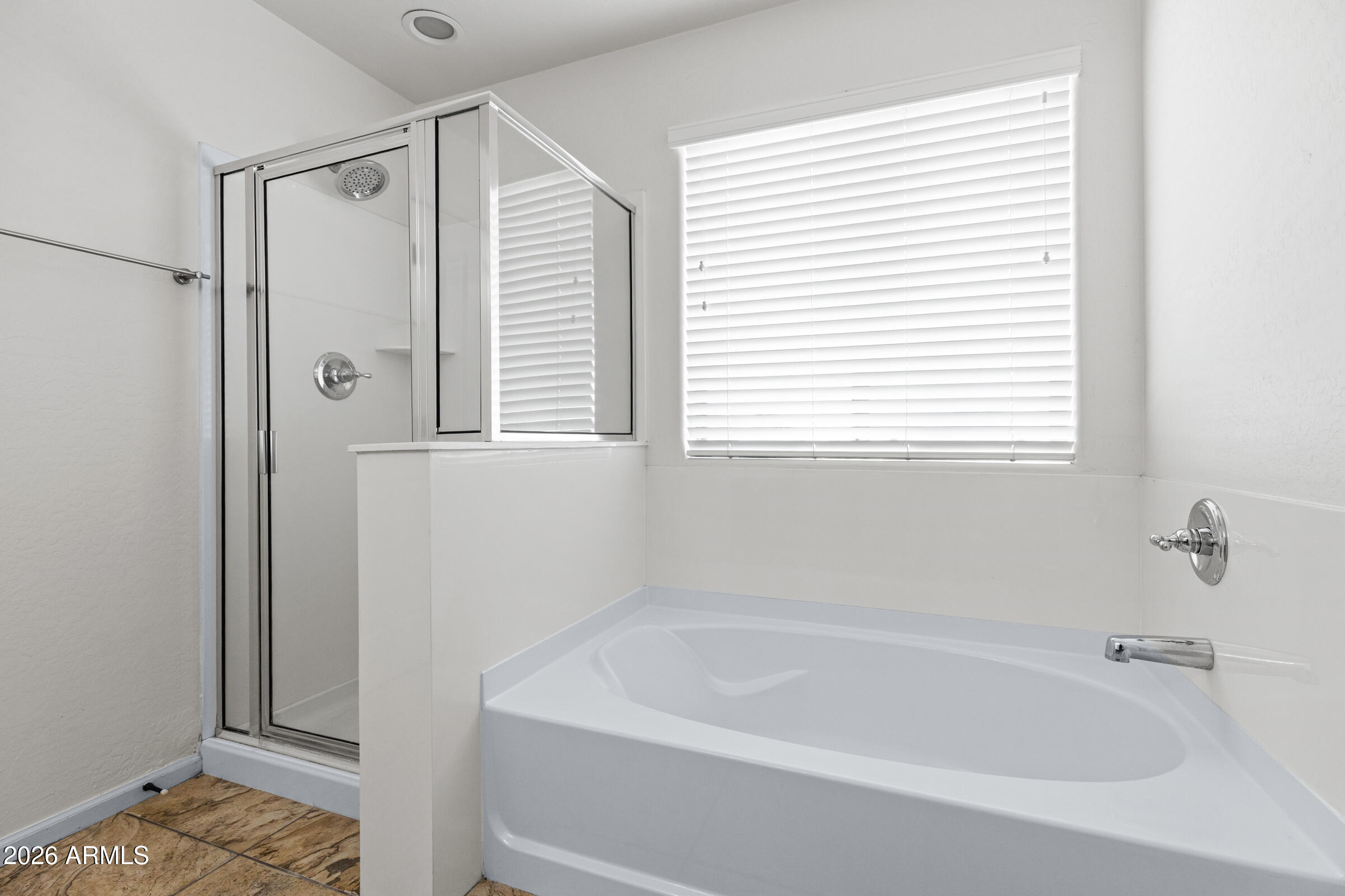 3029 East Franklin Avenue Gilbert, AZ 85295 - Photo 19 of 38 a white bath tub sitting next to a window