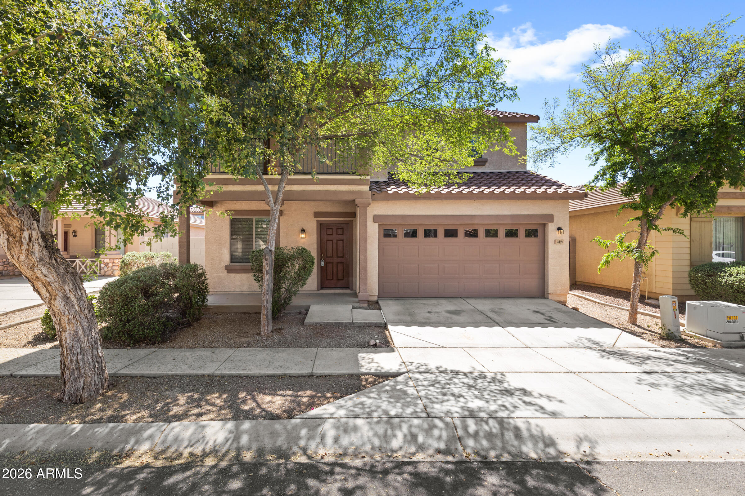 3029 East Franklin Avenue Gilbert, AZ 85295 - Photo 2 of 38 a front view of a house with garden
