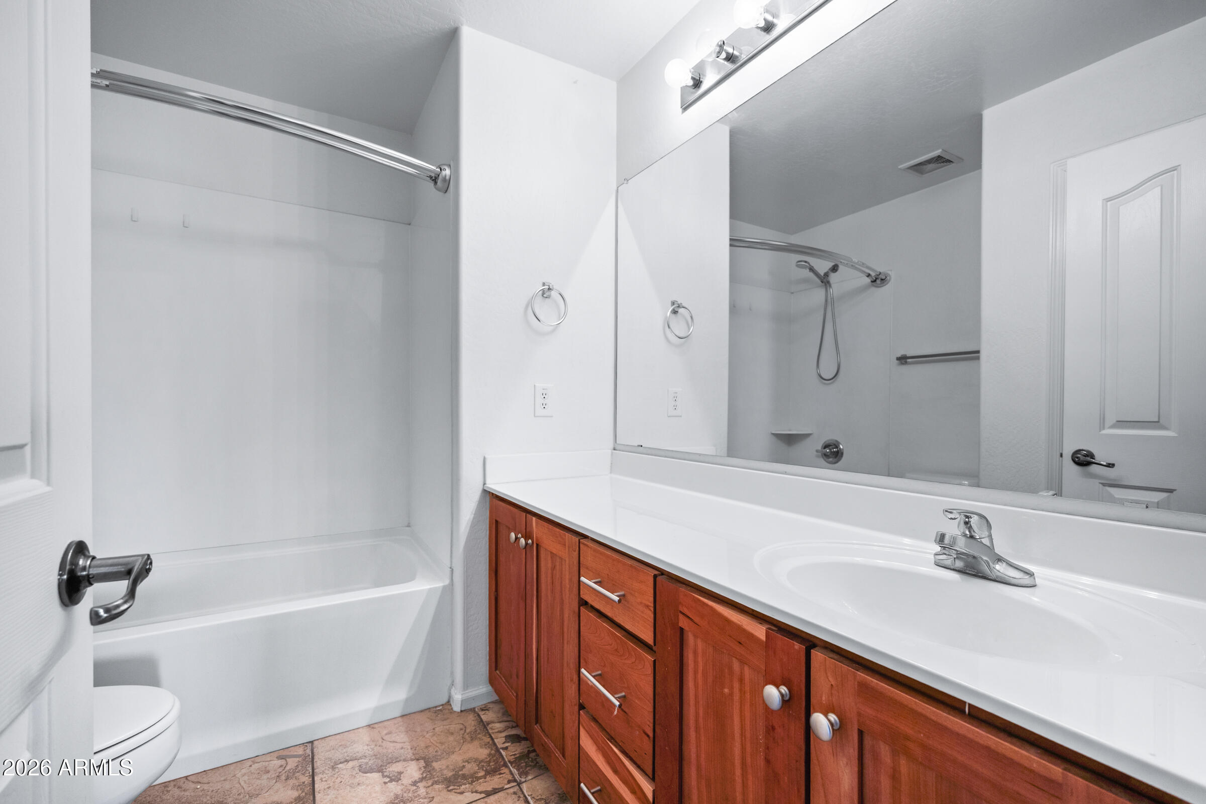 3029 East Franklin Avenue Gilbert, AZ 85295 - Photo 23 of 38 a bathroom with a tub double sink shower and mirror
