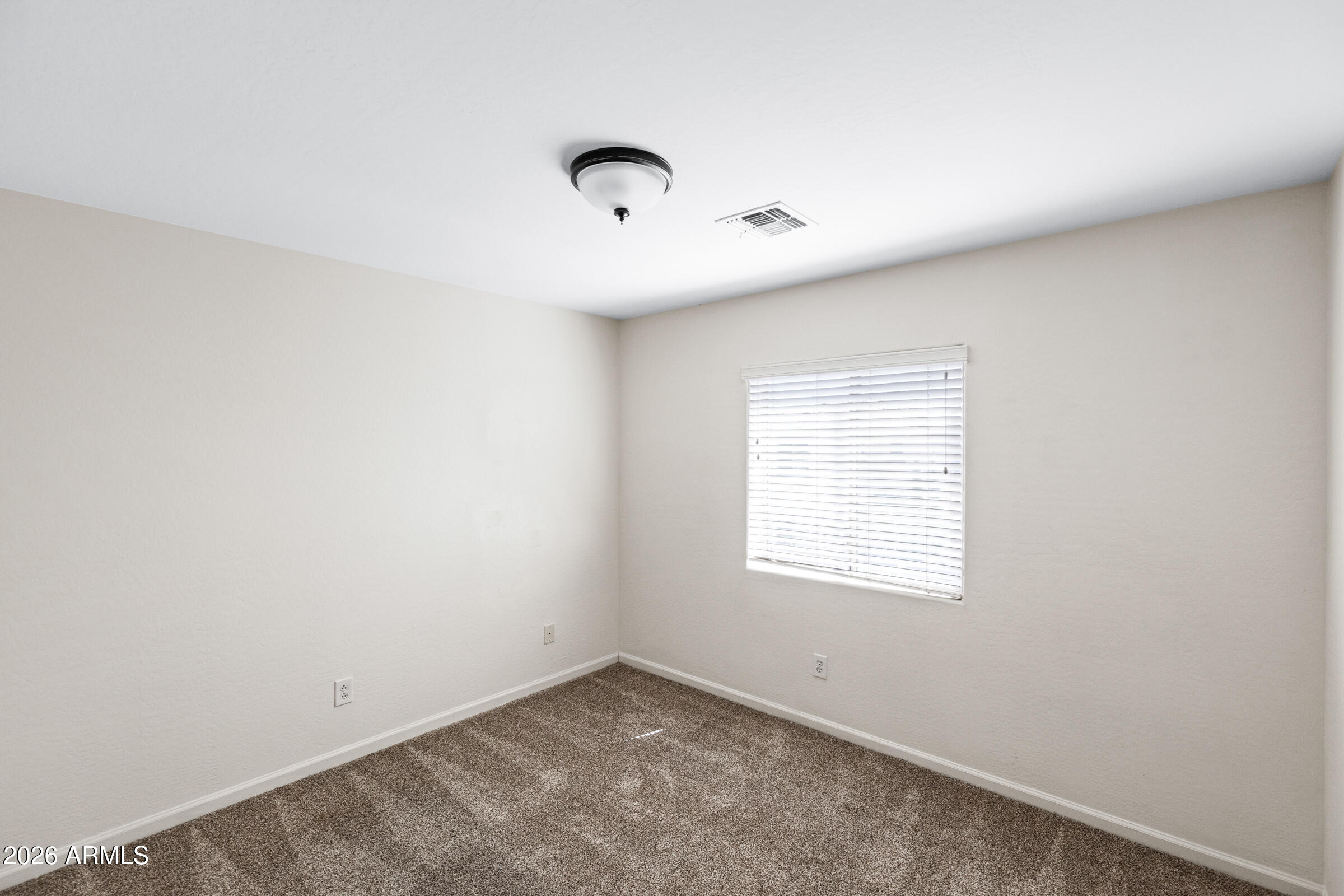 3029 East Franklin Avenue Gilbert, AZ 85295 - Photo 24 of 38 an empty room with a window