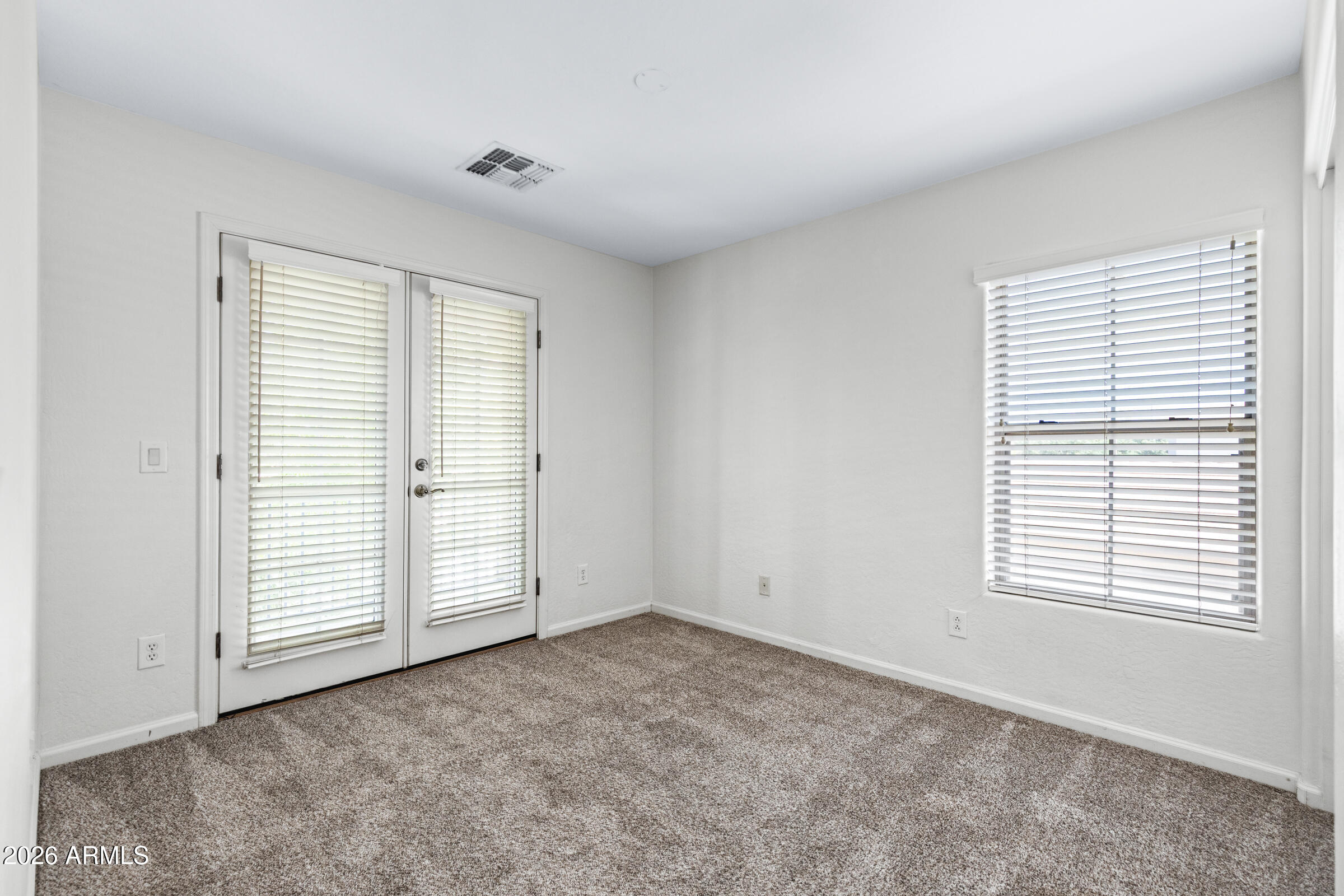 3029 East Franklin Avenue Gilbert, AZ 85295 - Photo 25 of 38 a view of an empty room with a window