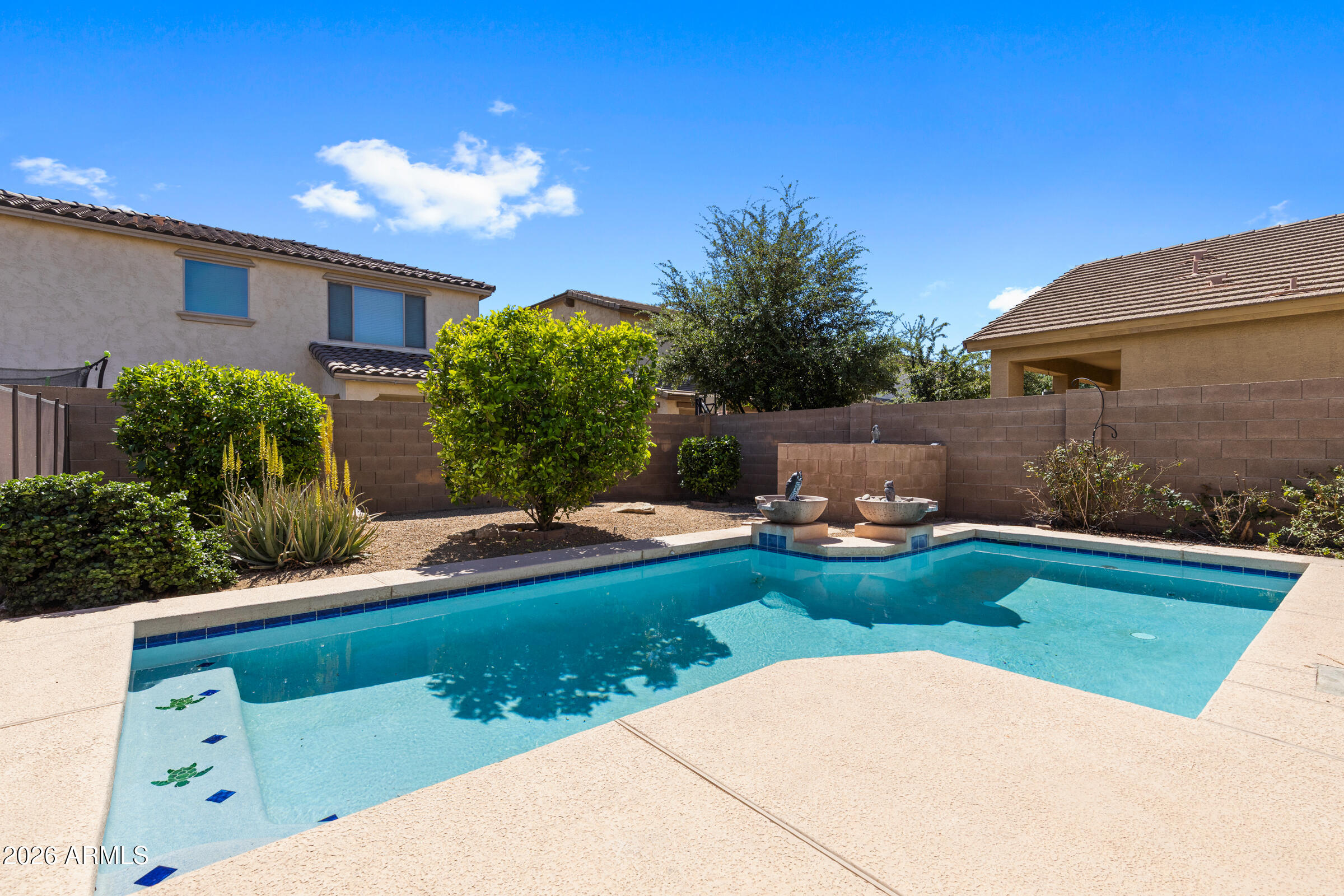 3029 East Franklin Avenue Gilbert, AZ 85295 - Photo 27 of 38 a view of backyard with swimming pool and outdoor seating