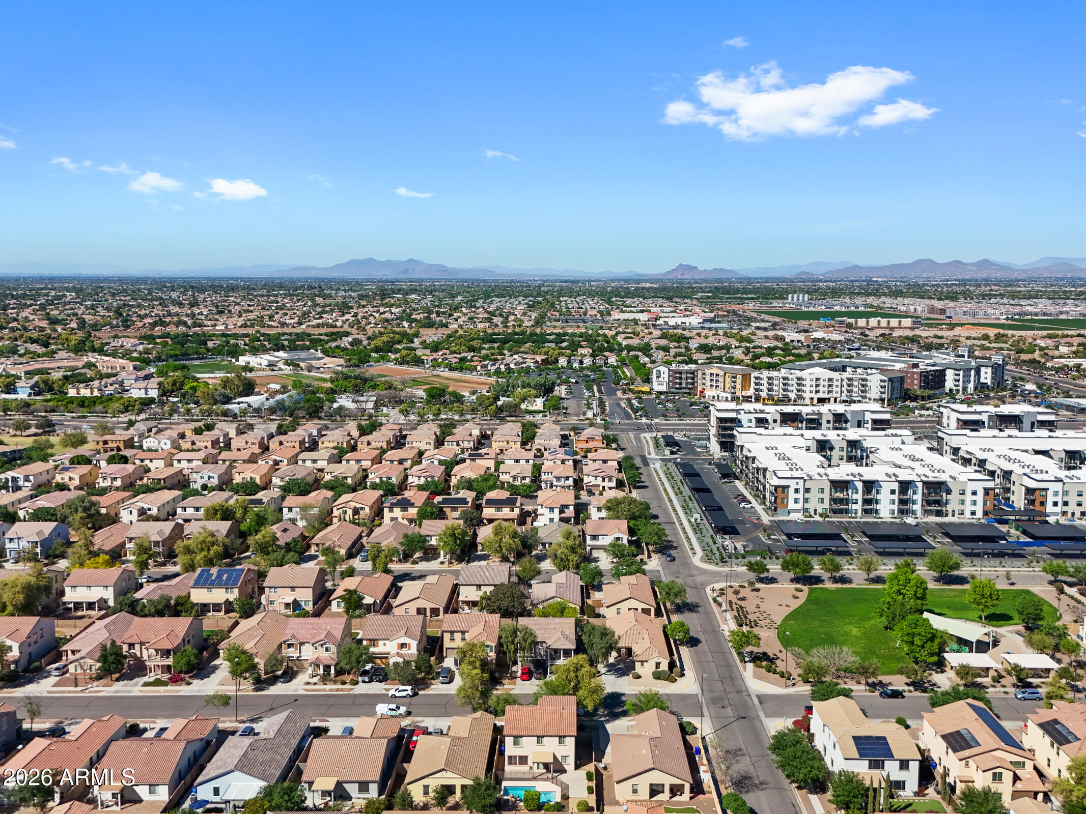 3029 East Franklin Avenue Gilbert, AZ 85295 - Photo 35 of 38 an aerial view of a city with lots of residential buildings and mountain view in back