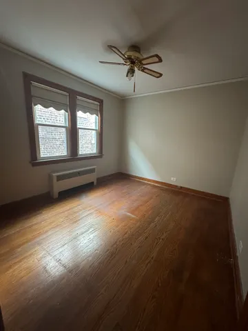 an empty room with a empty space and windows