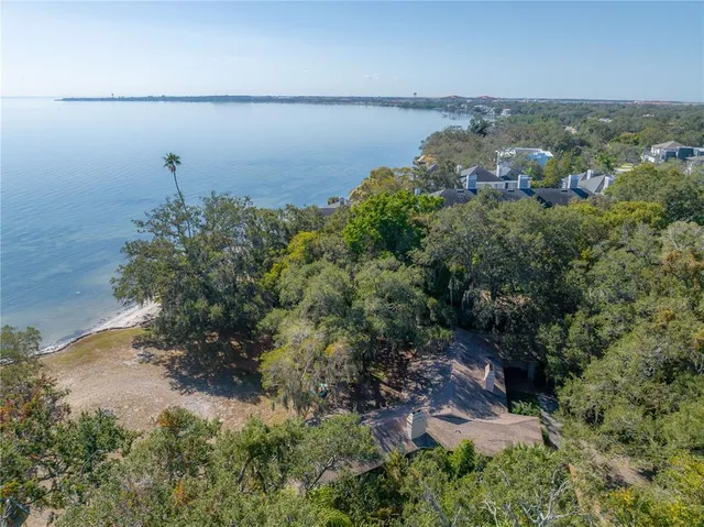 an aerial view of a houses with a yard