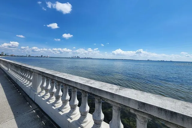 a view of a terrace with outdoor seating and city view